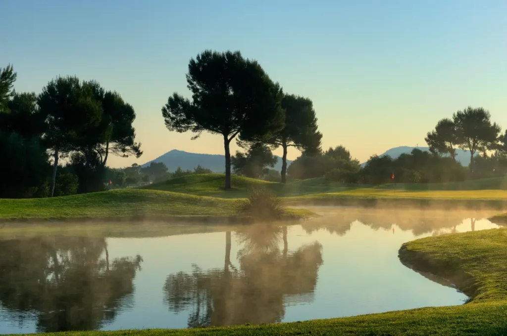 Son Antem West Golf Course View of Hole 9 with mist on lake in Mallorca