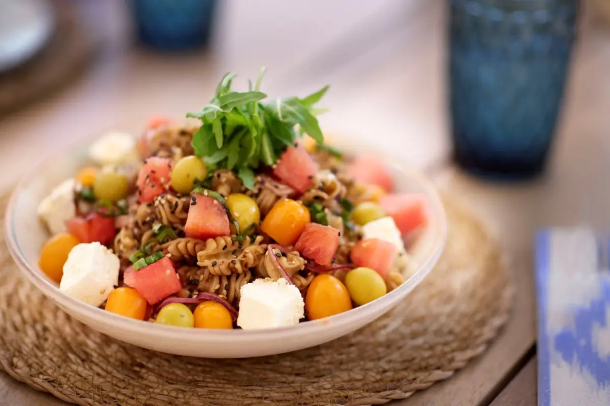 A vibrant salad with pasta, watermelon, and fresh greens at Son Antem Golf Mallorca La Terrassa Restaurant.